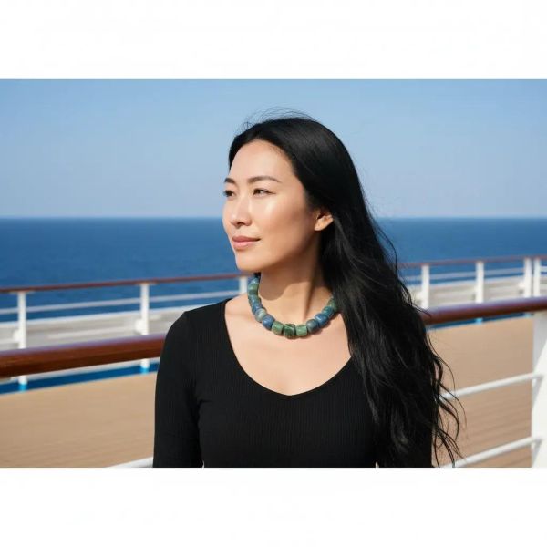 Naturale Aventurine Necklace Bold fortune, carved from the earth. This striking necklace is a celebration of Aventurine’s raw elegance and mythical charm. Composed of extra-large beads in rich shades of blue and green, each stone reveals its naturale character—swirls, flecks, and gradients formed over centuries. Unlike typical designs that rely on smaller, easier-to-drill beads, this piece defies convention. The hardiness of Aventurine makes large-scale craftsmanship a challenge, and that rarity is part of its allure. Measuring 18 inches, the necklace wears like a choker due to the generous size of the stones, but includes an extension to reach up to 22 inches for added versatility. The bold silhouette and saturated hues create a dramatic presence, ideal for those who favor statement pieces with soul. Aventurine is revered as a Lucky Talisman, believed to attract opportunity and shield against negativity. This necklace doesn’t just adorn—it empowers. Whether worn with minimalist attire or layered over textured fabrics, it commands attention while remaining grounded in its naturale origins. Let it be your daily armor or your ceremonial accent. With every bead, it whispers of resilience, beauty, and the quiet power of the naturale world.  **Please request a longer extension if you are ordering this necklace for a male.