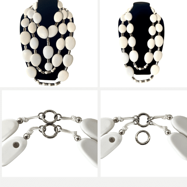 Inspired by the serene, wave‑polished stones of Bulugan Beach, this elegant two‑strand necklace set brings coastal calm and sculptural beauty to any wardrobe. Vulugan is a combo featuring large, flat, matte white oval beads paired with cool silver cylindrical accents, creating a clean, modern rhythm that feels both organic and refined. Each strand is crafted for versatility. The longer necklace measures 43 inches and weighs 16 ounces, draping gracefully to create a dramatic, elongated silhouette. The shorter strand, at 36 inches and 12 ounces, provides a balanced layer that can be worn alone for a lighter, minimalist look. Together, the two pieces weigh 28 ounces, forming a bold yet harmonious statement that moves effortlessly from day to evening. Wear them as a duo for maximum impact, or separate them to suit your mood and styling needs. Their matte finish and smooth contours echo the quiet strength of beach‑worn stones, making them a natural complement to linen, denim, or evening textures. For a complete look, see it paired with item 0369253 Single (sold separately).