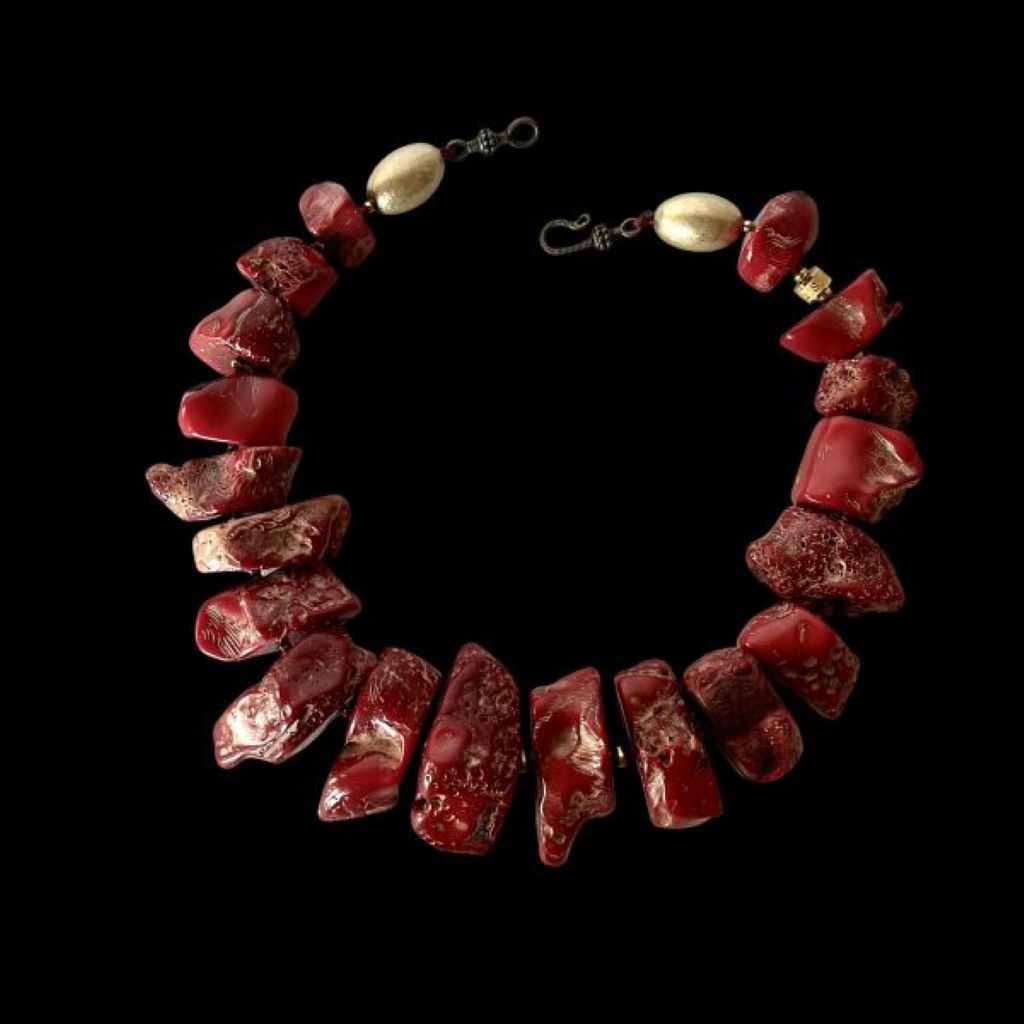 “Bold red two‑strand coral necklace with Apatite centerpiece displayed on a neutral background.”