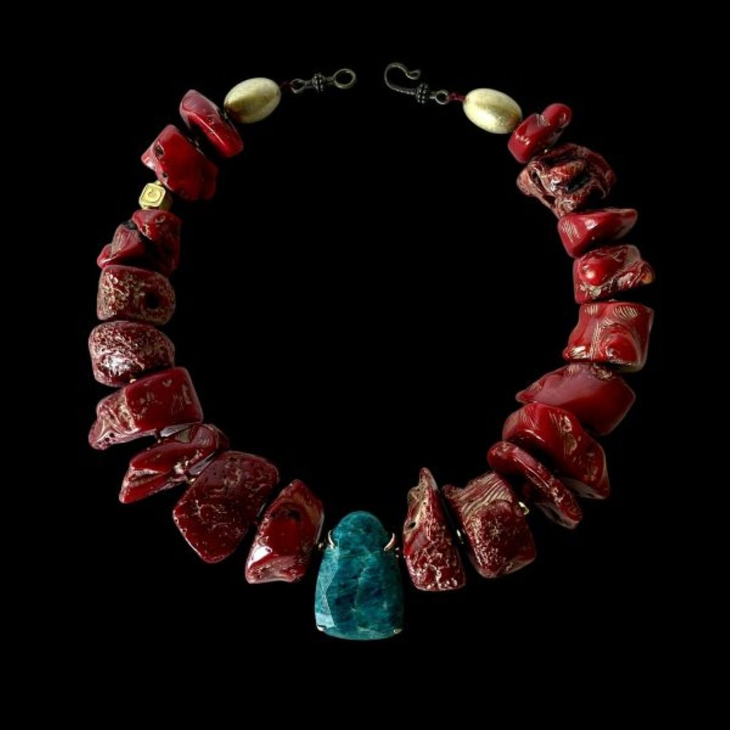 “Bold red two‑strand coral necklace with Apatite centerpiece displayed on a neutral background.”
