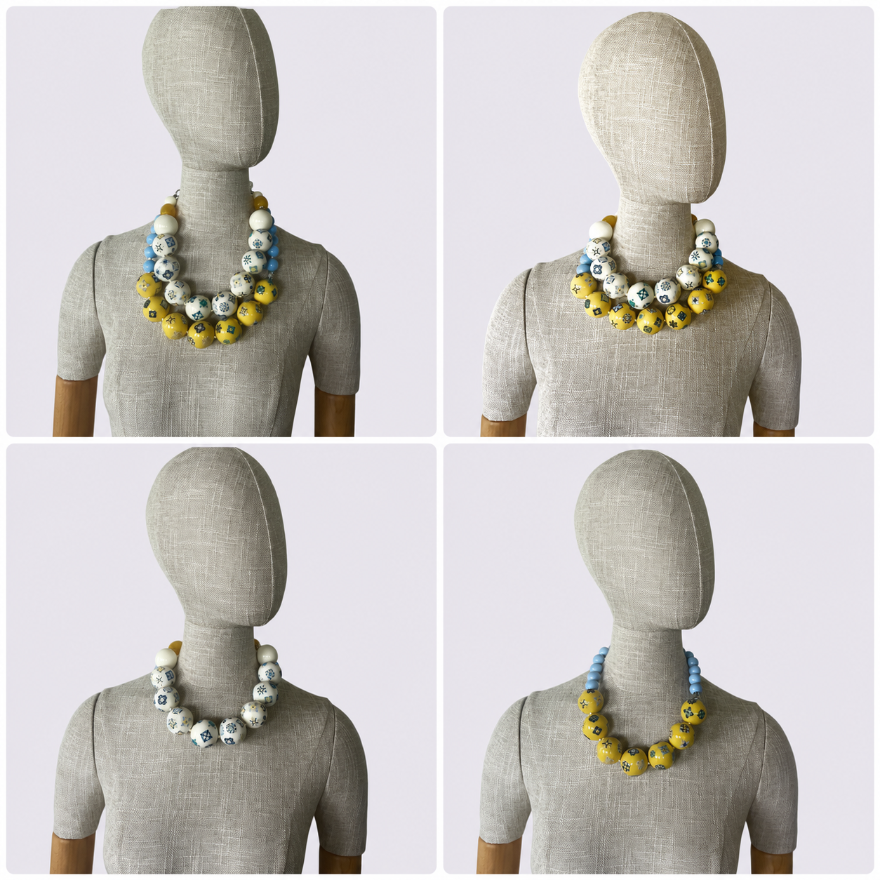 Two‑strand acrylic bead necklace set featuring Egyptian tile motifs in off‑white and yellow tones, displayed on a white background.
